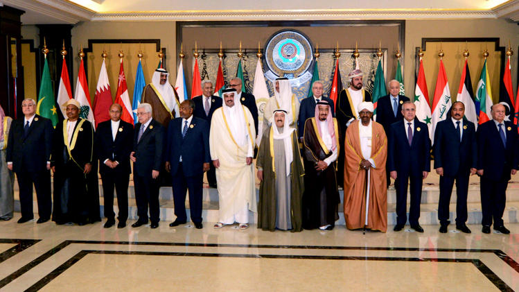 Arab leaders pose for a group photograph during the opening session of the Arab League Summit