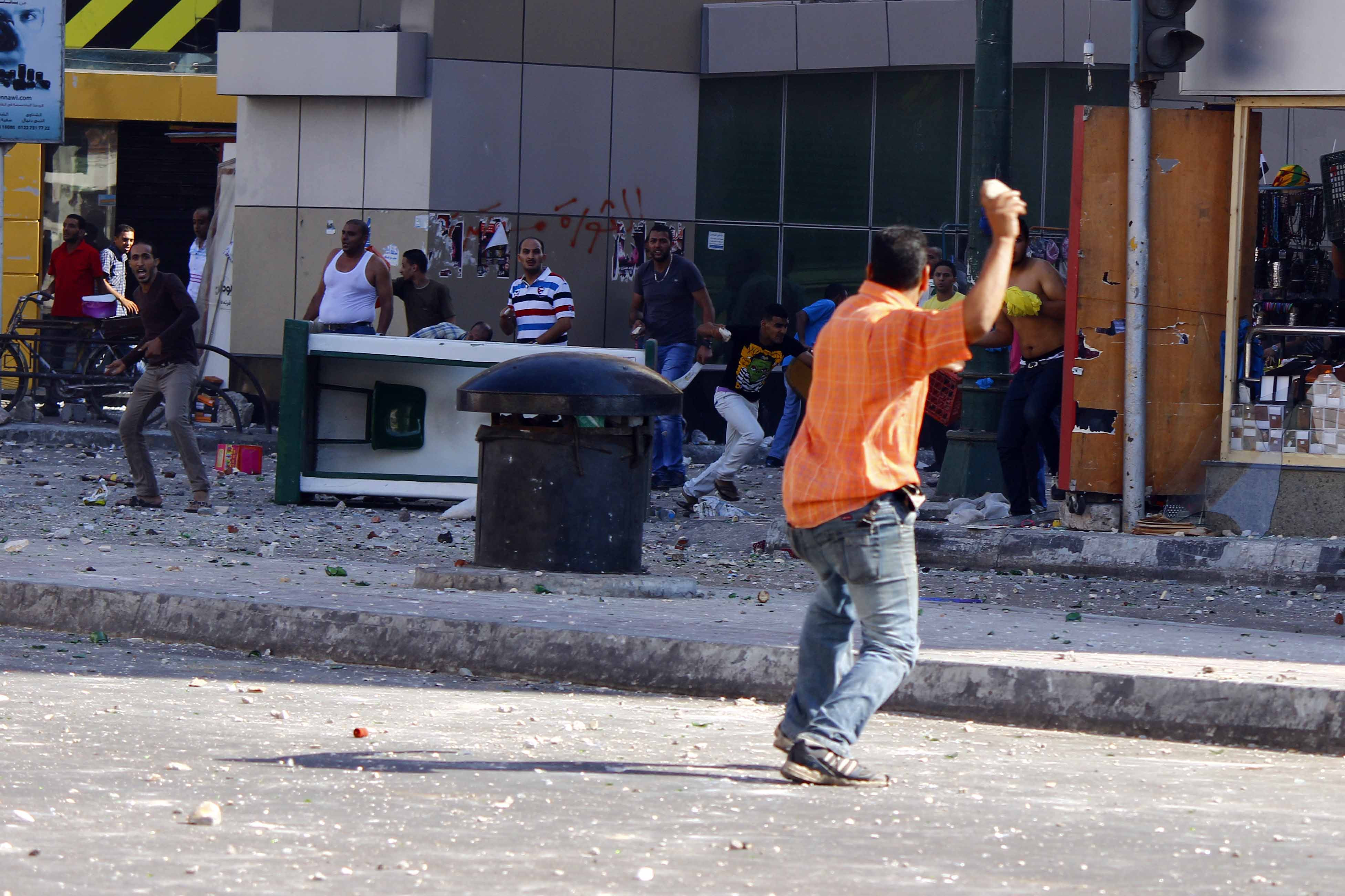 Egypt's interim government to look into compensating shop owners whose business were hurt by recent clashes. AFP Photo