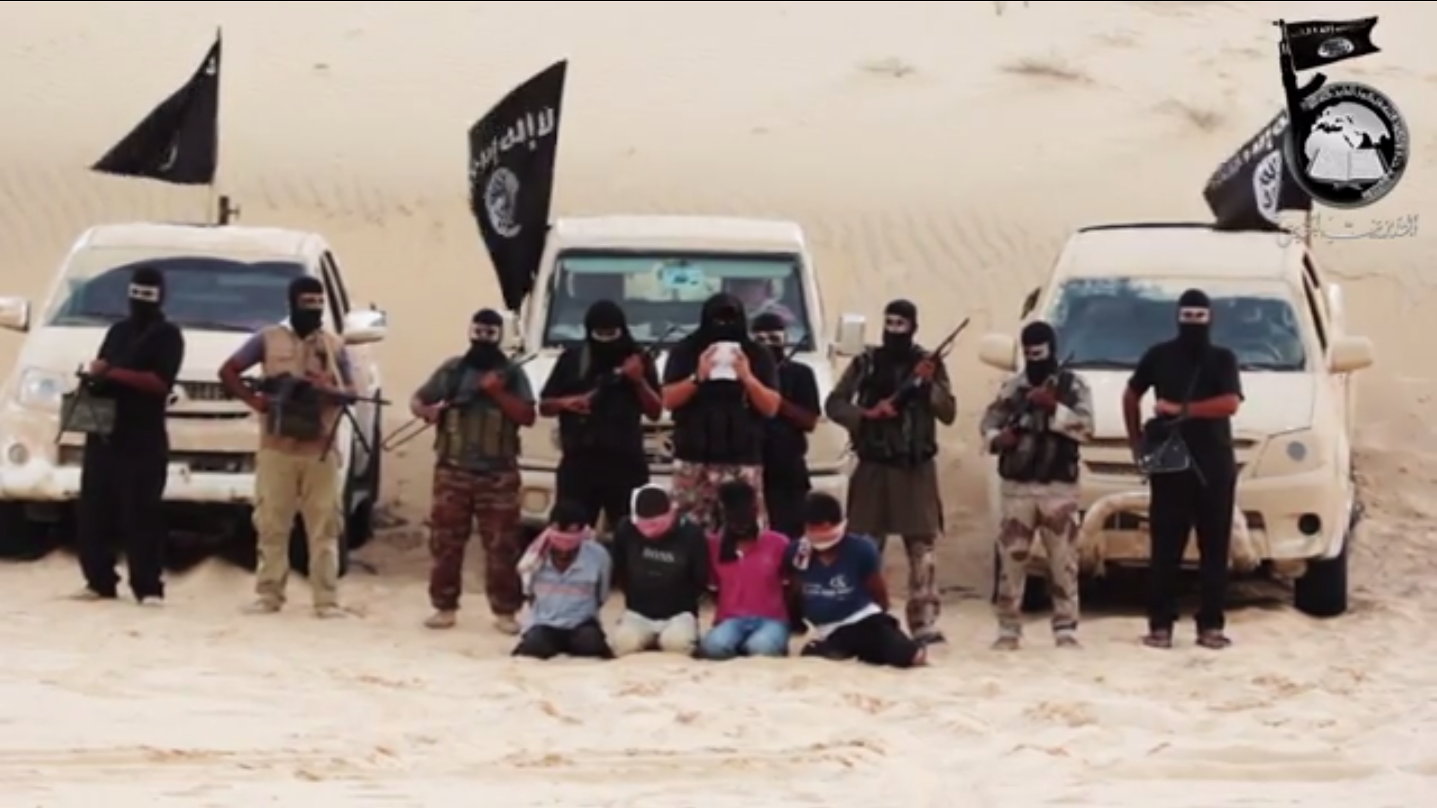 Screenshot of a video reportedly of Sinai based militant group Ansar Beit Al-Maqdis beheading four people (screenshot from YouTube)