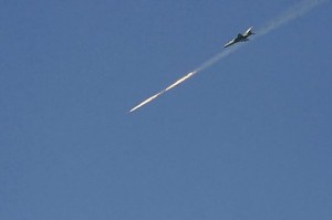 A Syrian warplane fires at a target in the northern Syrian city of Raqqa on March 6, 2013 (AFP/File, Mohammad al-Hussein)