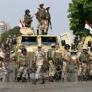Egyptian army soldiers block Salah Salem highway to prevent supporters of the Muslim Brotherhood and ousted Egyptian president Mohamed Morsi from crossing during their demonstration in Cairo, on July 19, 2013. (AFP Photo / Marwan Naamani)