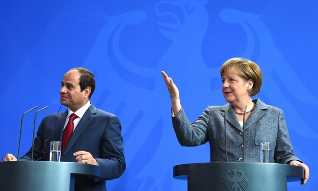 Egypt's President Abdel Fattah Al-Sisi with German Chancellor Angela Merkel