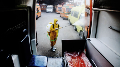 A man sterilizing an ambulance to protect against coronavirus (COVID-19) in Egypt