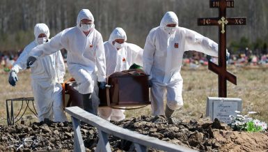 People carrying a coffin of someone who died from coronavirus in Russia Daily News Egypt