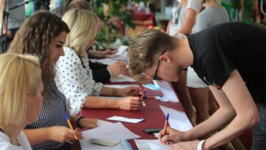 A man prepares to vote at a polling station in Minsk, Belarus, Aug. 9, 2020. Belarusians are heading to polling stations around the country on Sunday, the main voting day for them to elect their president. (Photo by Henadz Zhinkov/Xinhua)
