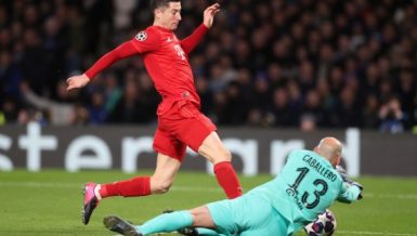 Bayern Munich's Robert Lewandowski (L) is blocked, Feb. 25, 2020. (Photo by Matthew Impey-Xinhua)