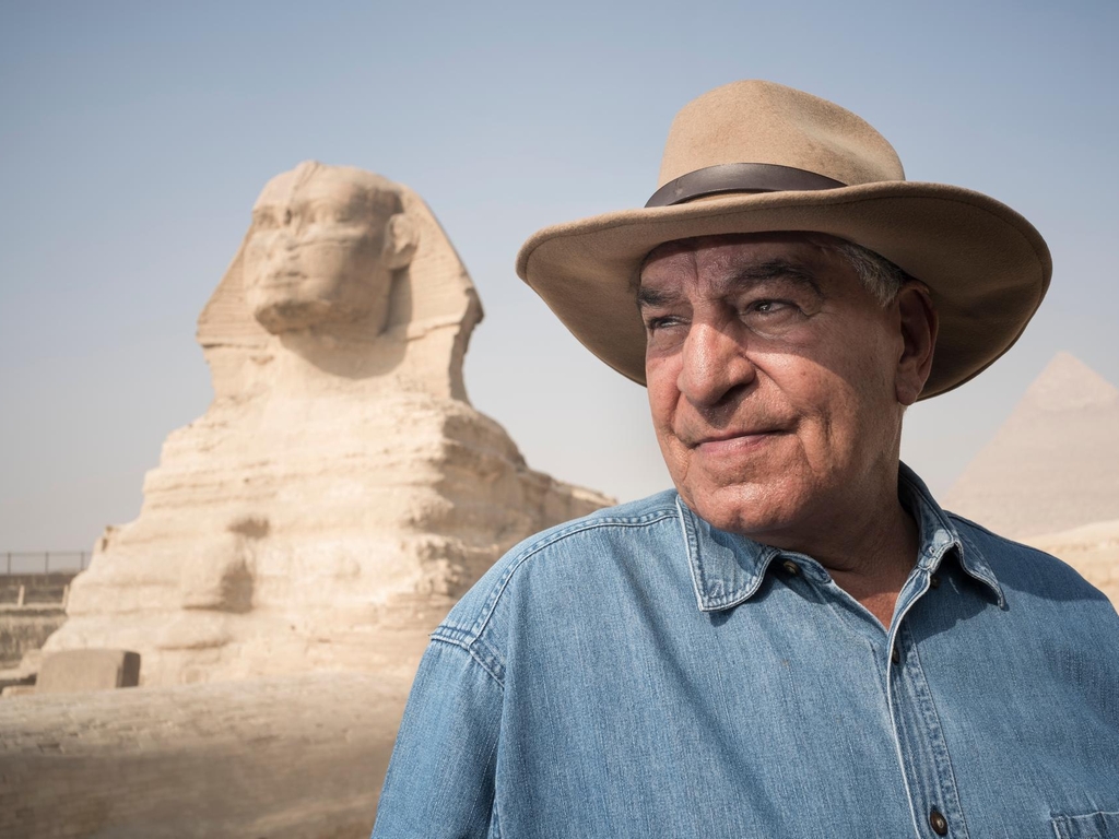 Zahi Hawass with the Sphinx in Giza Plateau on the outskirts of Cairo, Egypt, site of the Fourth Dynasty Giza Necropolis, which includes the Great Pyramids of Khufu, Khafre and Menkaure,