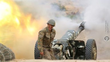 An ethnic Armenian soldier fires an artillery piece during fighting with Azerbaijan's forces in the breakaway region of Nagorno-Karabakh, September 29, 2020. Armenia Defense Ministry/Handout via REUTERS