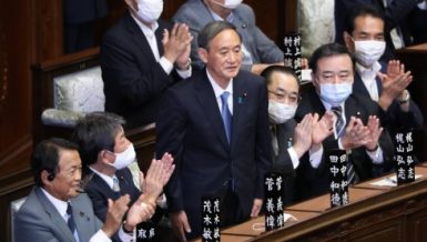 Yoshihide Suga (C) stands after being elected as Japan's new prime minister in Tokyo, Japan, on Sept. 16, 2020.