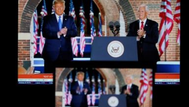Photo taken in Arlington, Virginia, the United States, on Aug. 26, 2020 shows screens displaying U.S. Vice President Mike Pence (R) being joined onstage by U.S. President Donald Trump after delivering his speech during the 2020 Republican National Convention from Fort McHenry in Baltimore, Maryland. (Xinhua/Liu Jie)