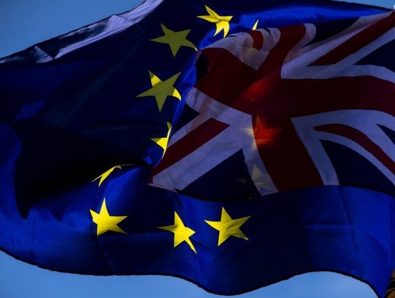 File photo taken on Oct. 19, 2019 shows the European Union flag and the Union Jack flag outside the Houses of Parliament in London, Britain. Brexit (Xinhua/Han Yan)