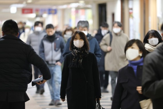 People wearing face masks walk in Tokyo, Japan, Jan. 7, 2021. (Xinhua-Du Xiaoyi)